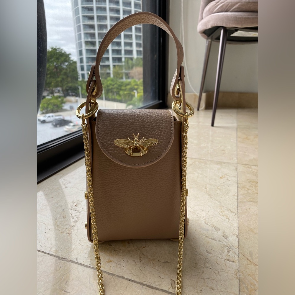 Taupe Purse with Gold Butterfly Detail & Detachable Gold Chain. Super cute!